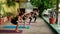 People on yoga session together outdoors, diverse girls on terrace