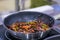 Pepper and beetroot frying and sizzling in pan