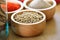 Peppercorn in wooden bowl on table