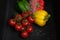 Peppers and tomatoes getting washed in sink as  healthy concept