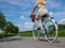 Per climate protection young woman rides her bicycle