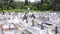 PERAK, MALAYSIA, Circa July 2015 - A family visiting their relative\'s grave and offers prayers by reciting verses from the Holy Bo