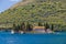 Perast in hte Bay of Kotor with views on the rising mountains and the church of the lady of the Rocks