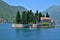 Perast, Montenegro - June 10. 2019 Natural islet with Saint George Benedictine monastery. Kotor Bay