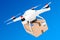 Percel Shipping Concept. Quadrocopter Drones Delivering a Parcel