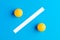 Percentage sign with two orange table tennis balls on blue background