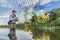 Perch fishing. Photo collage of angler in river water on soft focus perch fish background