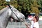 A Percheron horse with its female owner at the Foire St Gregoire show in ErnÃ©e, mayenne France 2018