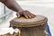 Percussionist playing a rudimentary atabaque during afro-brazilian capoeira fight