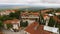 Perfect aerial view of Sighnaghi city hall with clock and green Alazani valley