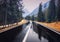 Perfect asphalt mountain road in overcast rainy day in Dolomites