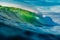 Perfect barrel wave in ocean. Breaking green wave with light