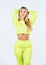 Perfect belly. fit woman in yellow tracksuit. sporty woman in homewear isolated on white. feeling cozy and comfortable