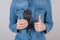 Perfect best choice for you concept. Cropped closeup photo of happy glad delightful confident teenager making giving finger up