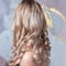 Perfect blonde, beautiful and well-groomed blonde hair. Long curls,