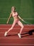 perfect body. healthy lifestyle. workout on outdoor stadium. physical training. athletic lady.