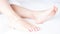 Perfect clean female feet .Beautiful and elegant woman`s, girl foot .Spa ,scrub and foot care concept.Light room, clean bedding