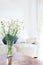 Perfect daisy flowers on a table in white living room in front o