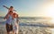 The perfect family vacay. a young family enjoying a day at the beach.