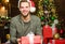 Perfect gift is combination of thought delivery and presentation. Man Santa claus with gift box. Handsome guy celebrate