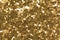 Perfect glitter background in shiny gold tone, luxury texture for expensive design.