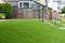 Perfect grass landscaping with artificial grass in residential area