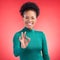 Perfect, hand and happy black woman portrait in studio for support, review or success, vote or agree on red background