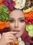 Perfect healthy woman on colorful vivid organic fruits and vegetables chips background, healthy eating and diet concept
