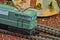 Perfect model of the electric locomotive. Train hobby model on the model railway. Close-up