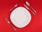 Perfect modern table setting on red napkin background