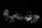 Perfect mystical curly horizontal white steam or smoke isolated on black background. Abstract background fog or smog