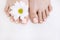 Perfect nude pedicure on white background