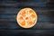 Perfect pizza with slices of tomatoes squash onion and sweet pepper on a dark background. Top view center orientation