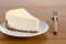 Perfect plain cheesecake on white plate