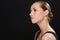 Perfect profile. Studio shot of an attractive young woman isolated on black.