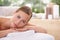 This is perfect relaxation. A young woman on a massage table in a spa.