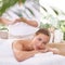 This is perfect relaxation. A young woman on a massage table in a spa.