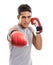 The perfect strike. Portrait of a handsome young kick-boxer punching against a white background.