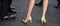 Perfect for the suited look. Womens shoes on high heels. Female and male legs in shoes. Classic mens shoes. Human legs