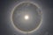 The perfect sun halo ring in the afternoon sky