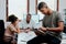 The perfect tool for a modern manager. a young businessman using a digital tablet during a meeting in a modern office.