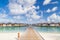 Perfect view of luxury water villas in Maldives island. Blue sea and blue sky, idyllic sea view from a wooden pier pathway