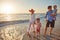 The perfect way to bond as a family. a young family enjoying a day at the beach.