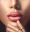 Perfect woman\'s sensual lips with beige matte lipstick