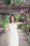 Perfect young woman with bird in spring park outdoor