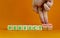 Perfectionism symbol. Concept words Perfect or Perfectionism beautiful wooden blocks. Beautiful orange background. Businessman