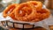 Perfectly fried onion rings crispy, golden, and cooked to perfection in bubbling hot oil