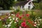 A Perfectly Proportioned Scandinavian Cottage Surrounded by a Vibrantly Colored Flower Garden