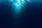 Perfectly seamless of deep blue ocean waves from underwater background with micro particles flowing, light rays shining through