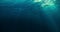 Perfectly seamless loop of deep blue caribbean ocean waves from underwater background